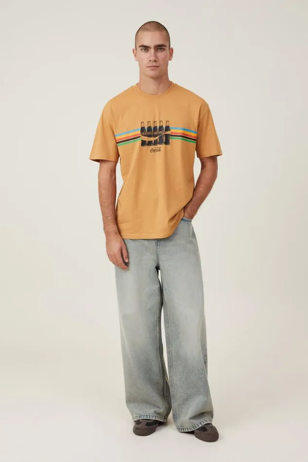 Loose Fit Pop Culture TShirt Lcn Cok Bronze Stripe Bottles Men Cotton On Tees and Tanks Loose Fit Pop Culture TShirt Lcn Cok Bronze Stripe Bottles Men Cotton On Tees and Tanks