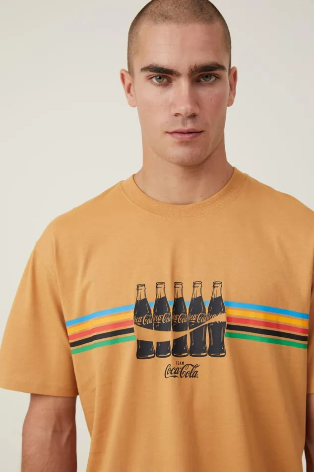 Loose Fit Pop Culture TShirt Lcn Cok Bronze Stripe Bottles Men Cotton On Tees and Tanks Loose Fit Pop Culture TShirt Lcn Cok Bronze Stripe Bottles Men Cotton On Tees and Tanks